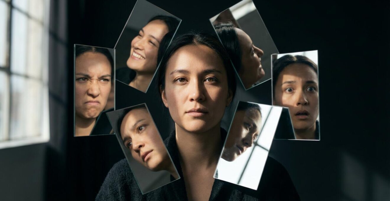 Person surrounded by mirrors reflecting increasingly distorted versions of themselves, representing algorithmic echo chambers